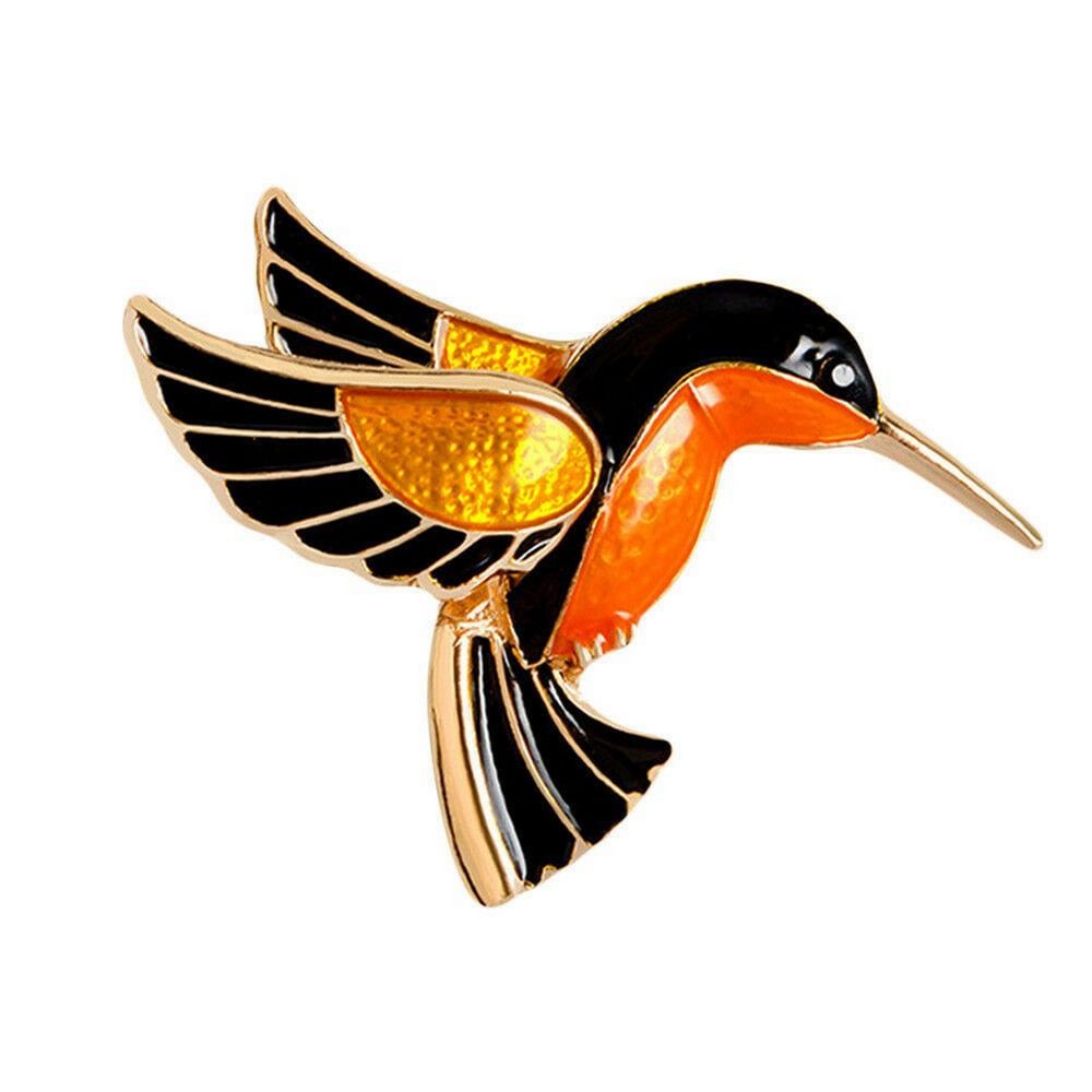 Elegant Ladies Enameled Hummingbird Brooch: Elegant Ladies Enameled Hummingbird Brooch. This vibrant brooch captures the grace and beauty of a hummingbird mid-flight. With delicate details and a striking combination of orange, black, and golde