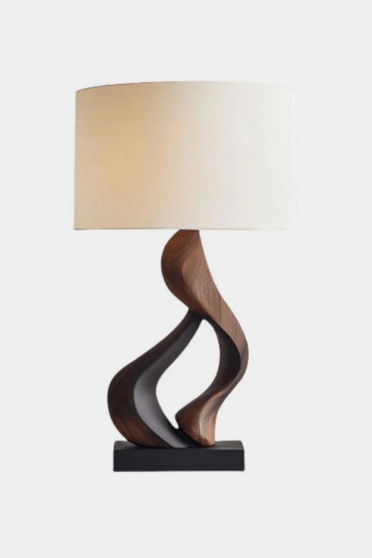 Intertwined Curve Wooden Table Lamp: Intertwined Curve Wooden Table Lamp Graceful and modern, this handcrafted table lamp features two smoothly curved wooden elements that twist together in a sculptural embrace. Mounted on a sleek black