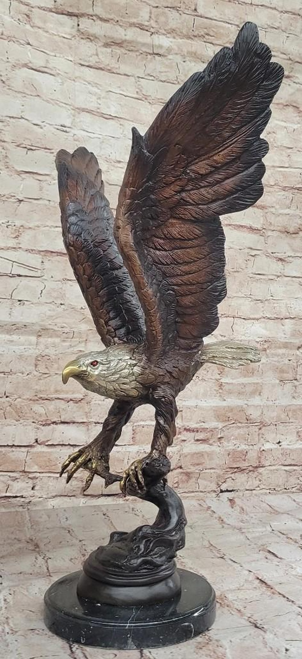 Signed Moigniez Inspired Eagle Catching Fish Bronze Reproduction Sculpture: Signed Moigniez Inspired Eagle Catching Fish Bronze Reproduction Sculpture - 24" x 13" This captivating sculpture features a majestic eagle in mid-flight, its powerful wings extended high abo