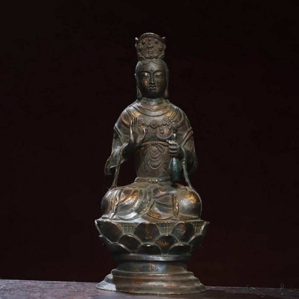 Handcrafted Gilded Copper Guanyin Buddha Statue: Handcrafted Gilded Copper Guanyin Buddha Statue This antique Guanyin Buddha statue is a testament to traditional Chinese craftsmanship, expertly handcrafted from pure copper and adorned with a rich g