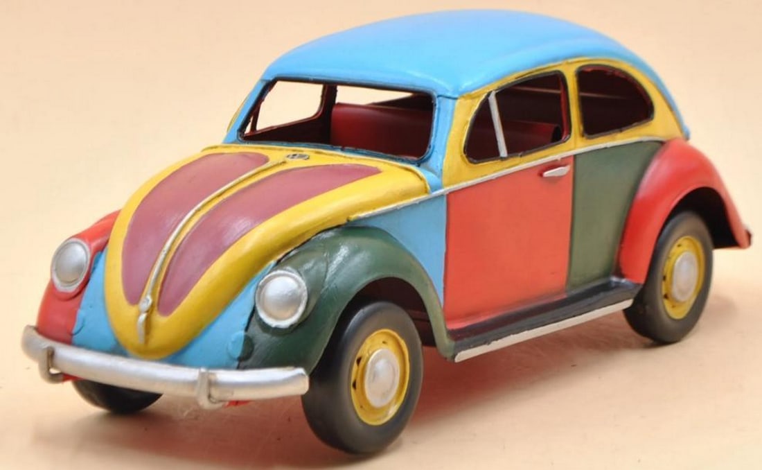Vibrant Vision: 1934 Volkswagen Beetle Rainbow Edition: Vibrant Vision: 1934 Volkswagen Beetle Rainbow Edition This stunning 1/12 scale die-cast model of the 1934 Volkswagen Beetle is a bold and playful tribute to the iconic car, reimagined with a