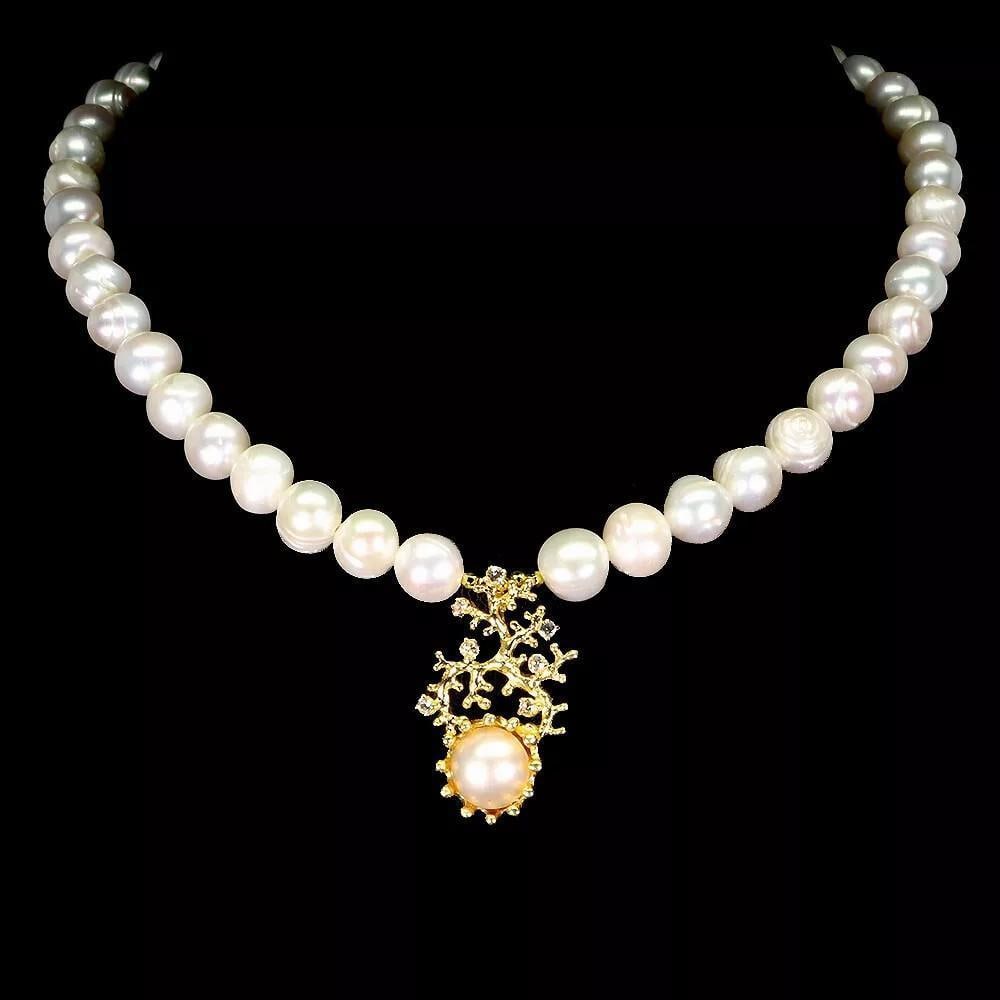 925 Sterling Silver Necklace with Topaz and Natural Pearl 17": 925 Sterling Silver Necklace with Topaz and Natural Pearl 17" This elegant 17" necklace features a natural pearl and sparkling topaz set in 925 sterling silver, blending classic beauty