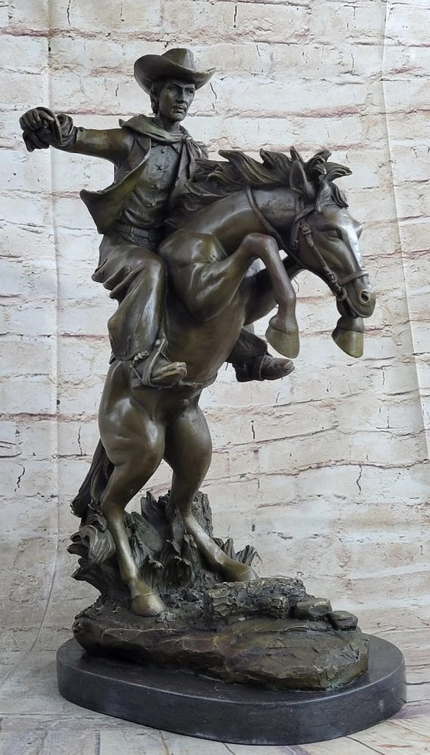 Remington Inspired Bronco Buster Bronze Sculpture - 20" x 14": Remington Inspired Bronco Buster Bronze Sculpture - 20" x 14" Experience the untamed spirit of the Wild West with this captivating bronze sculpture. A seasoned cowboy fearlessly rides his wild