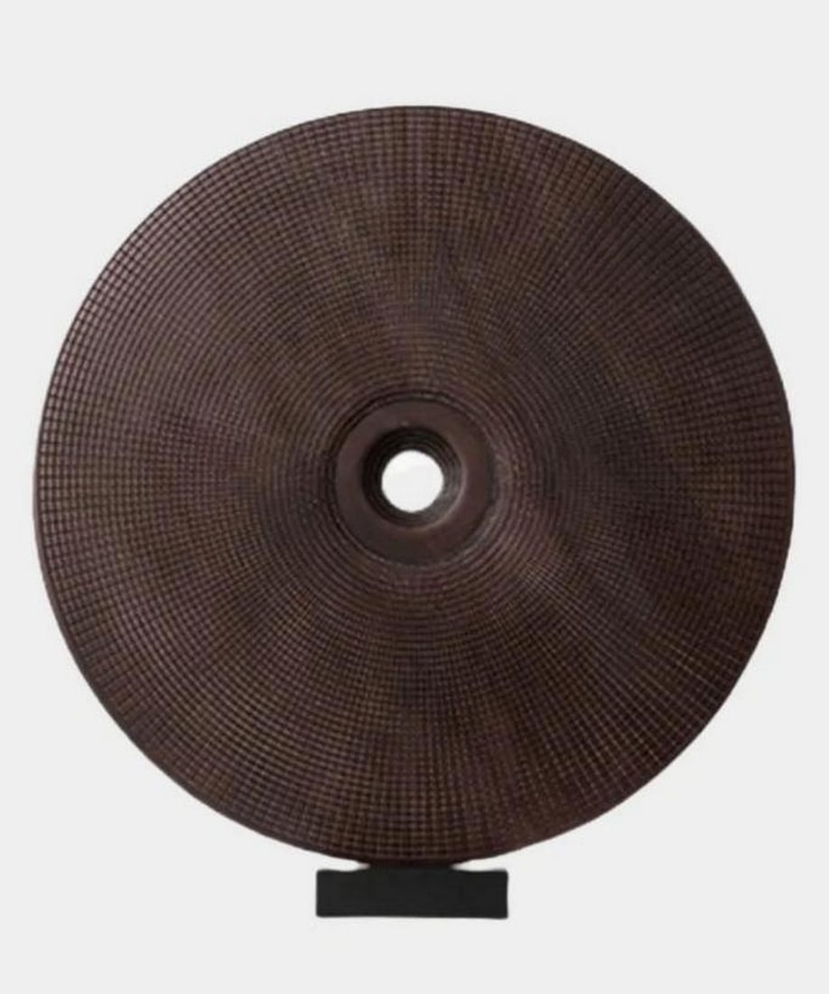 “Eclipse Form?? Woooden Abstract Sculpture: “Eclipse Form” Woooden Abstract Sculpture A hand-carved circular wooden sculpture featuring a rich, textured grain and a central opening, evoking the quiet drama of an eclipse. Mounted on a mi