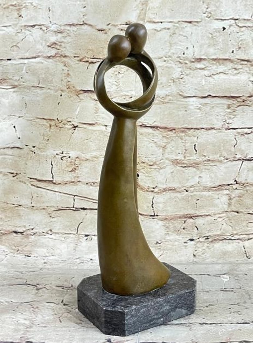The Whispers of Passion Between a Kissing Couple Bronze Sculpture - 12" x 5": The Whispers of Passion Between a Kissing Couple Bronze Sculpture - 12" x 5" Experience the captivating beauty of eternal unity with this exquisite bronze sculpture. Designed in an abstract fo