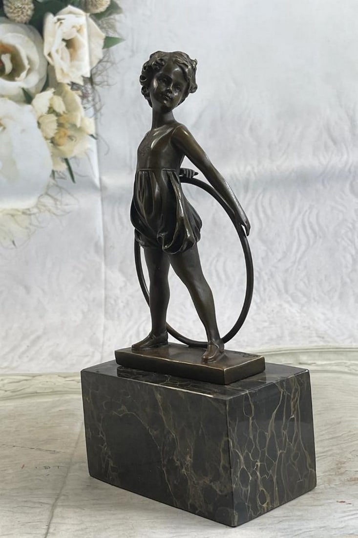 Young Girl with Hula Hoop Bronze Sculpture on Marble Base - 10" x 5": Young Girl with Hula Hoop Bronze Sculpture on Marble Base - 10" x 5" This bronze sculpture depicts a young girl playing with a hula hoop, pausing thoughtfully as she balances it behind her bac