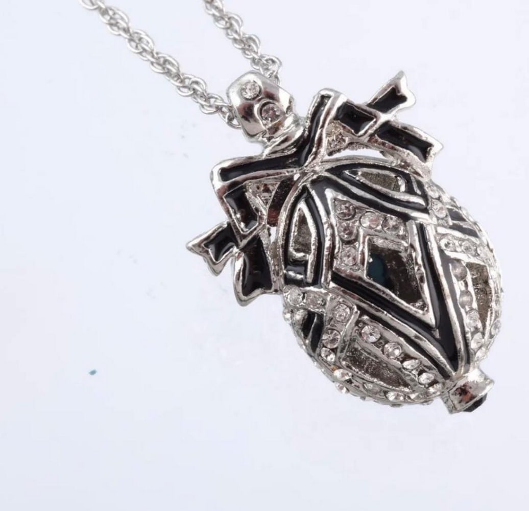 Black Bow Austrian Crystal Egg Pendant: Black Bow Austrian Crystal Egg Pendant This egg pendant is a great gift for a loved one or for yourself. It is such a unique present it is made for art lovers who get inspired by beautiful things. Thi