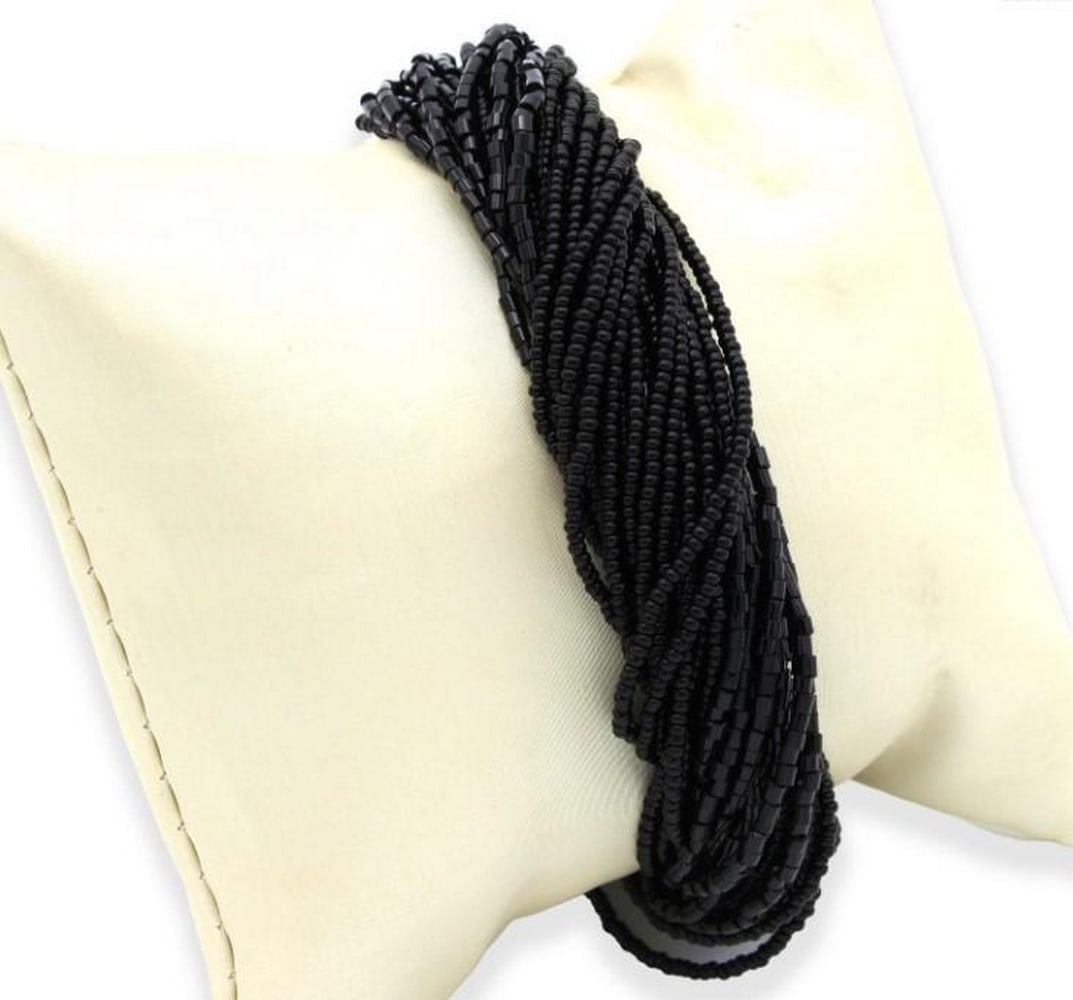 Black Millefili Conterie Beaded Glass Bracelet: Black Millefili Conterie Beaded Glass Bracelet The term "Millefili Conterie" refers to a thousand threads, capturing the intricate nature of this exquisite piece. The deep, velvety black hue a