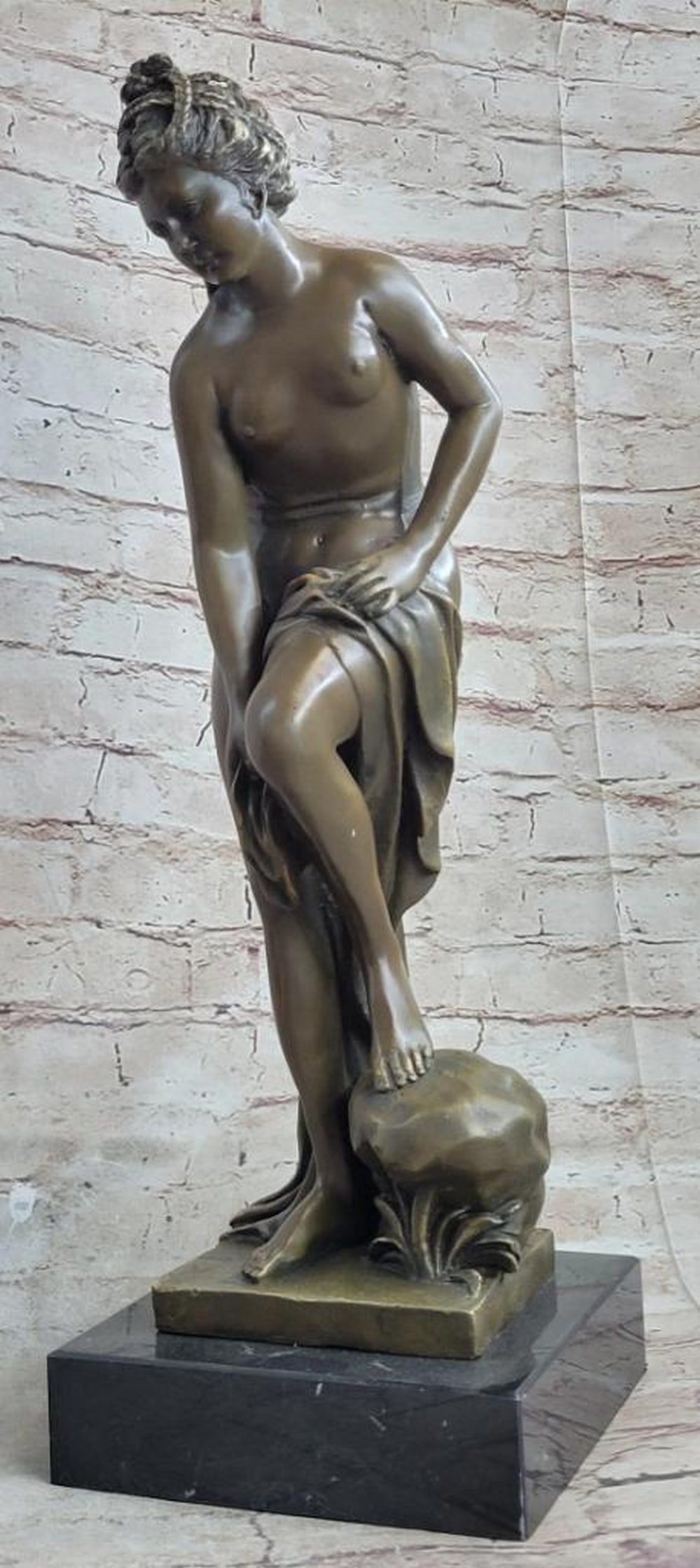 Solitude and Grace" Bronze Nymph Sculpture by Jean Patoue - 16" x 6: "Solitude and Grace" Bronze Nymph Sculpture by Jean Patoue - 16" x 6" This captivating bronze statue evokes the image of a nymph, pausing to bask in the sun before returning to the wat