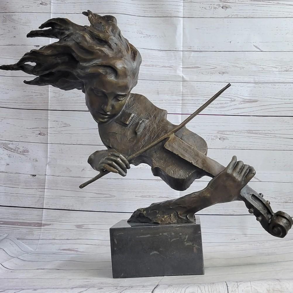Female Fiddle Player Bust Original Bronze Statue - 23" x 31": Female Fiddle Player Bust Original Bronze Statue - 23" x 31" Immerse yourself in the world of music and art with this captivating bronze sculpture. The graceful figure of a woman, her hair flo