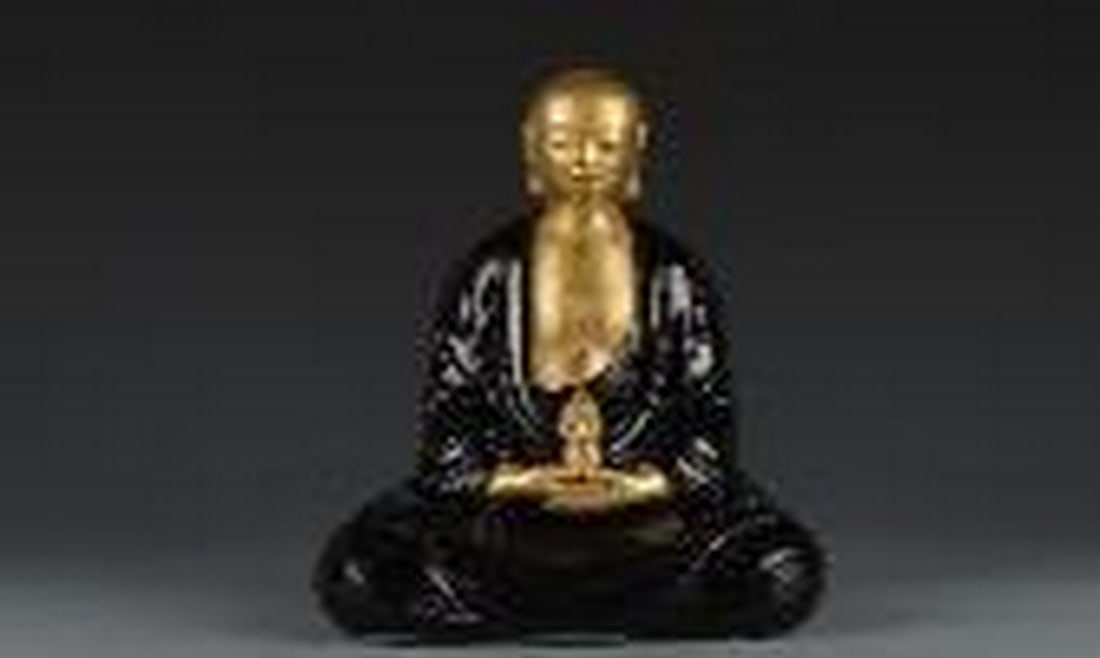 Gold buddha with black glazing clothes (1 of 1)