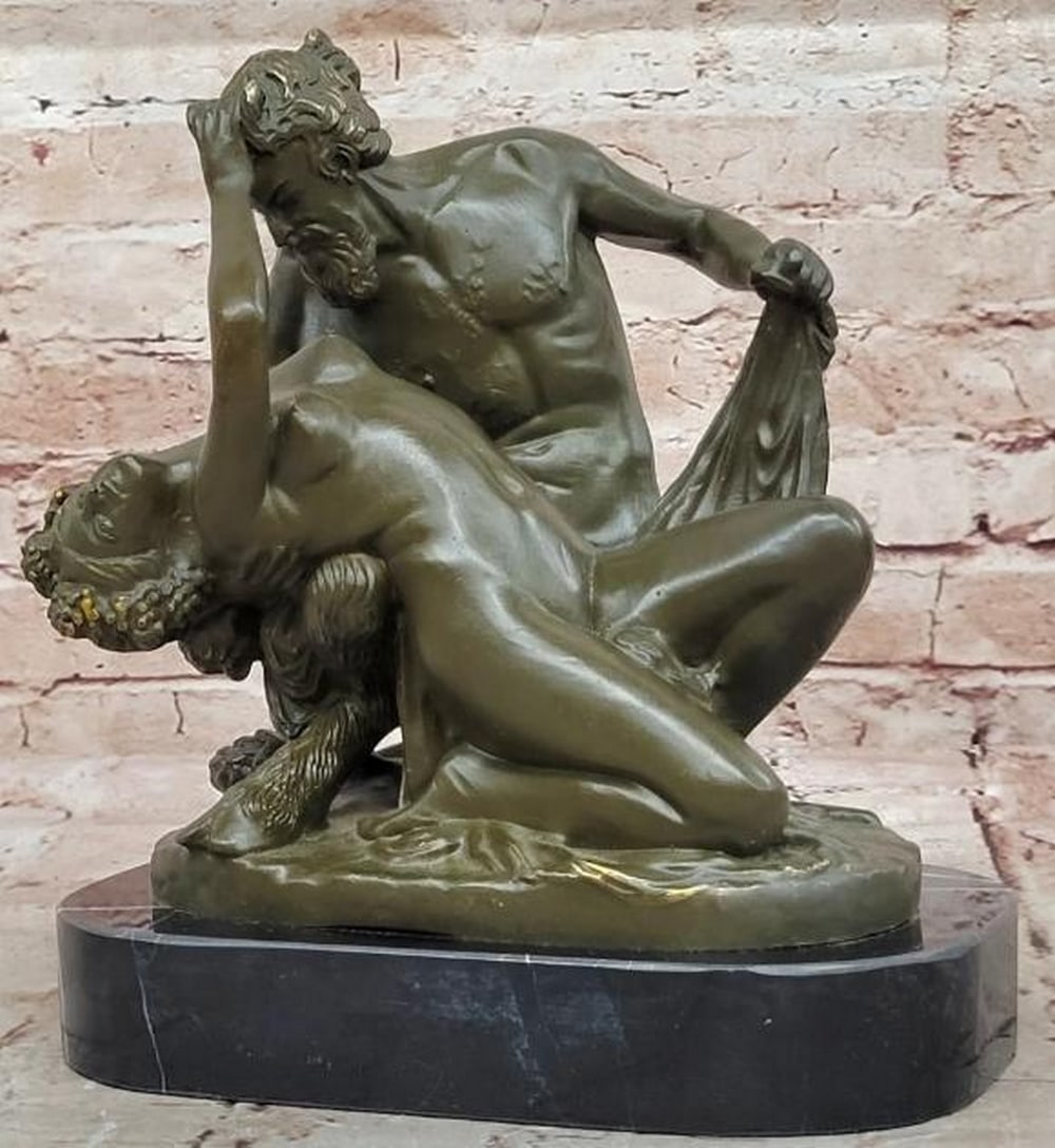 Entwined Passions Bronze Sculpture of Satyr and Nymph: Entwined Passions Bronze Sculpture of Satyr and Nymph A captivating bronze sculpture that captures the raw sensuality and mythological allure of a satyr and nymph in an intimate embrace. The nude saty
