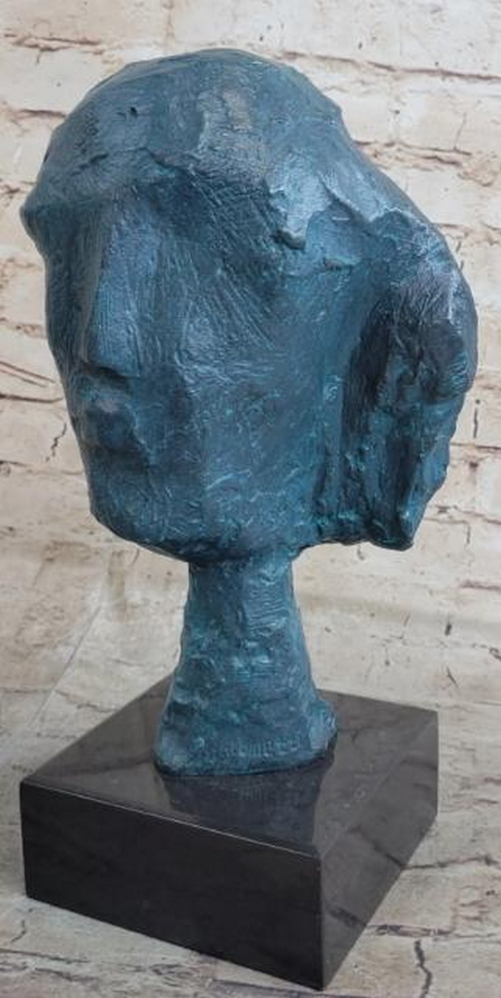 Abstract Female Bust Bronze Sculpture: Abstract Female Bust Bronze Sculpture Raw and evocative, this abstract modern bronze sculpture presents a female bust reduced to its essential contours. With rough, textured edges and only the faintes