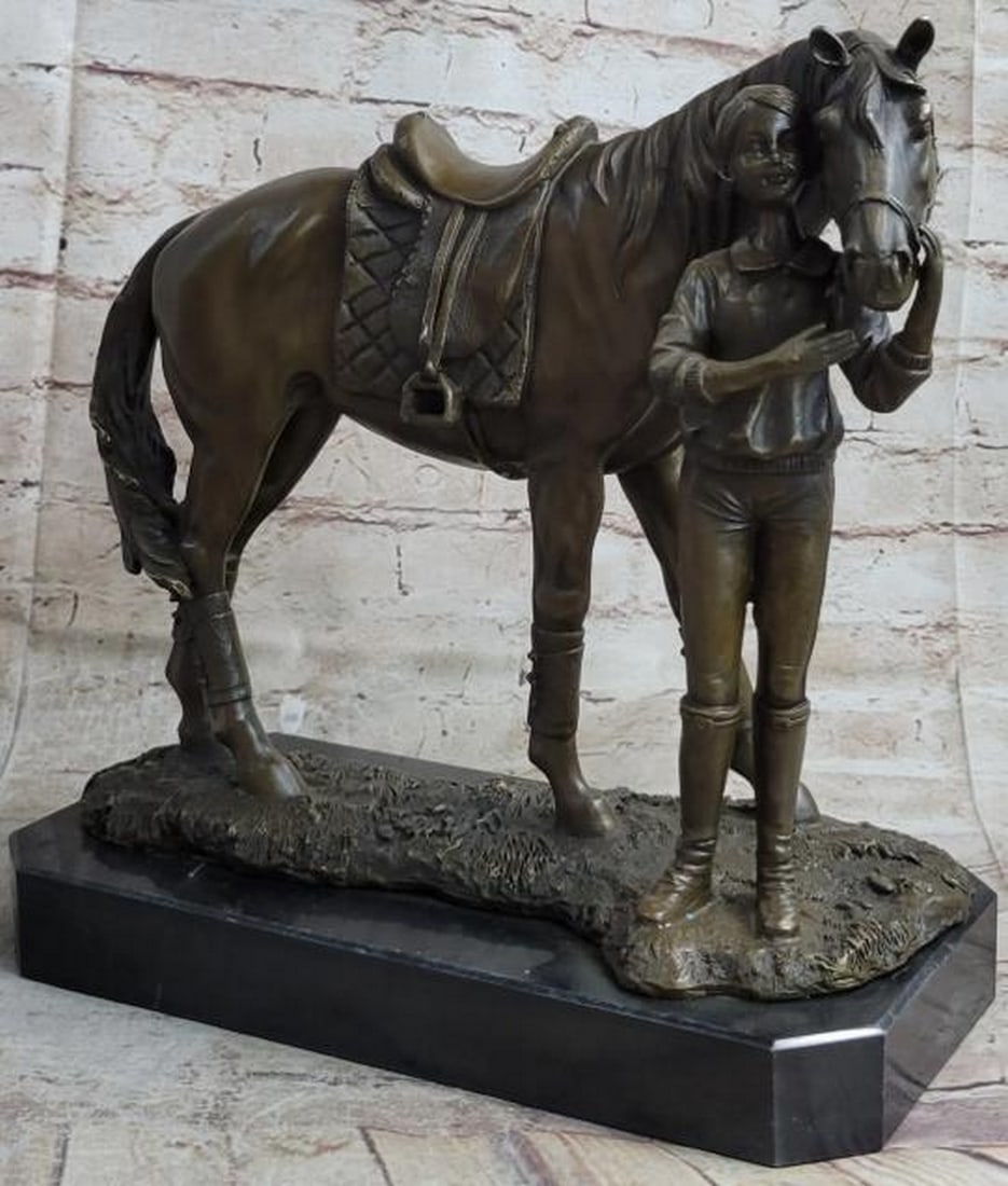 Equestrian Girl with Horse Bronze Statue: Equestrian Girl with Horse Bronze Statue This heartwarming bronze statue captures a tender and timeless moment between a young girl and her beloved horse. The little equestrian stands lovingly beside 
