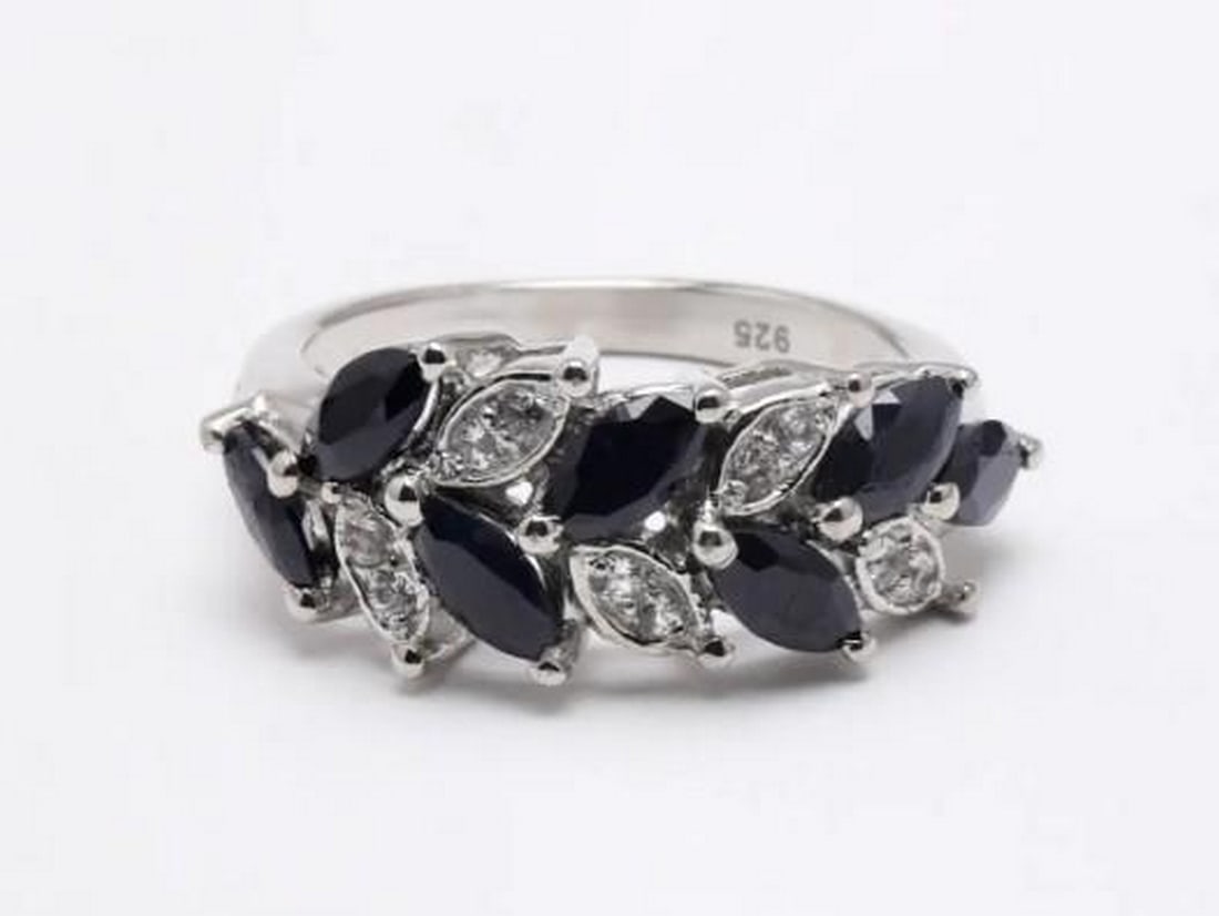 Midnight Leaves: Midnight Leaves — Black Onyx and Cubic Zirconia Ring Embrace the allure of nature with this stunning ring, crafted to resemble a delicate, stylized leaf. The intricate design features a captivating 