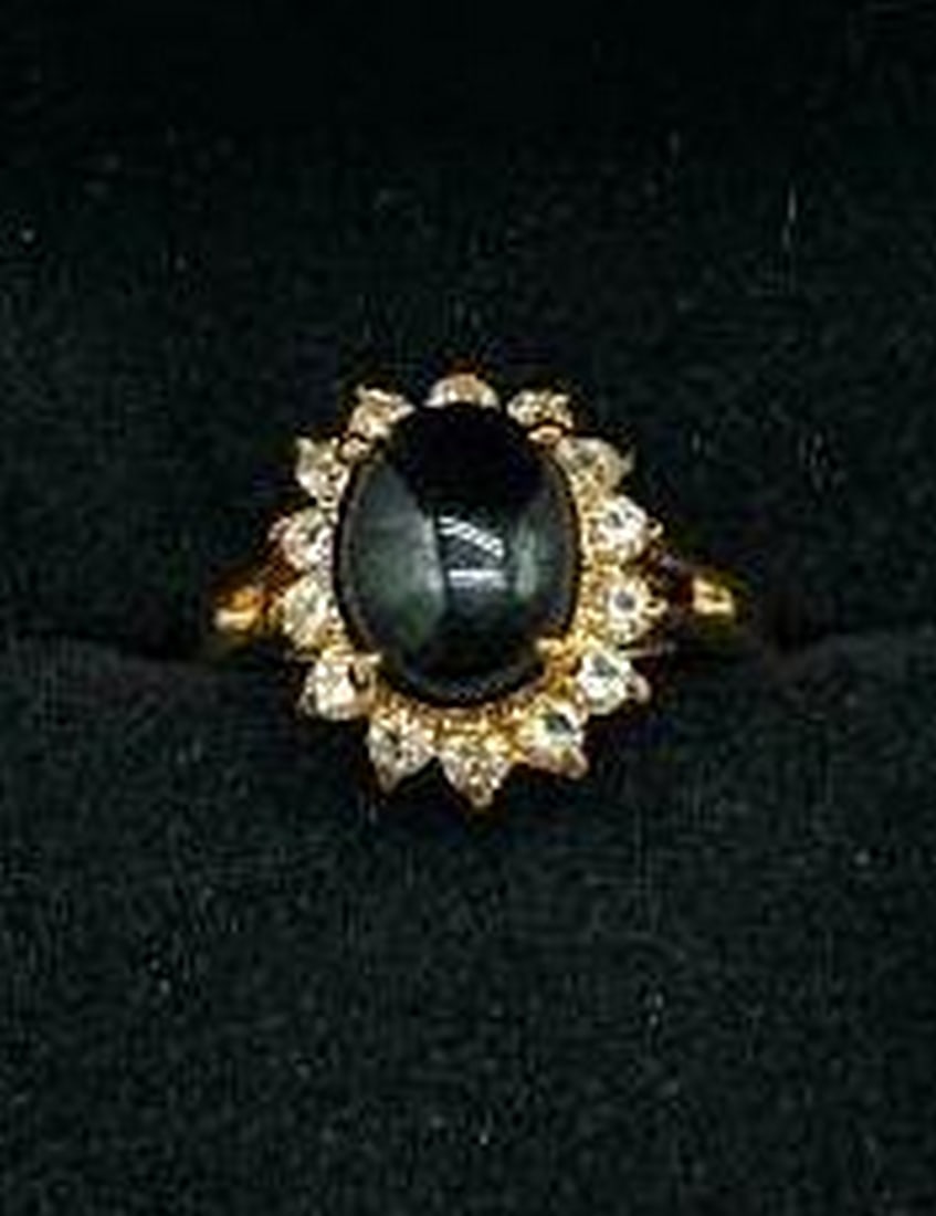 Black Onyx Solitaire Crown Ring with White Crystal Accents: Black Onyx Solitaire Crown Ring with White Crystal Accents Bold elegance meets timeless design in this striking ring, featuring a round black onyx stone set in a regal solitaire crown setting. The ric