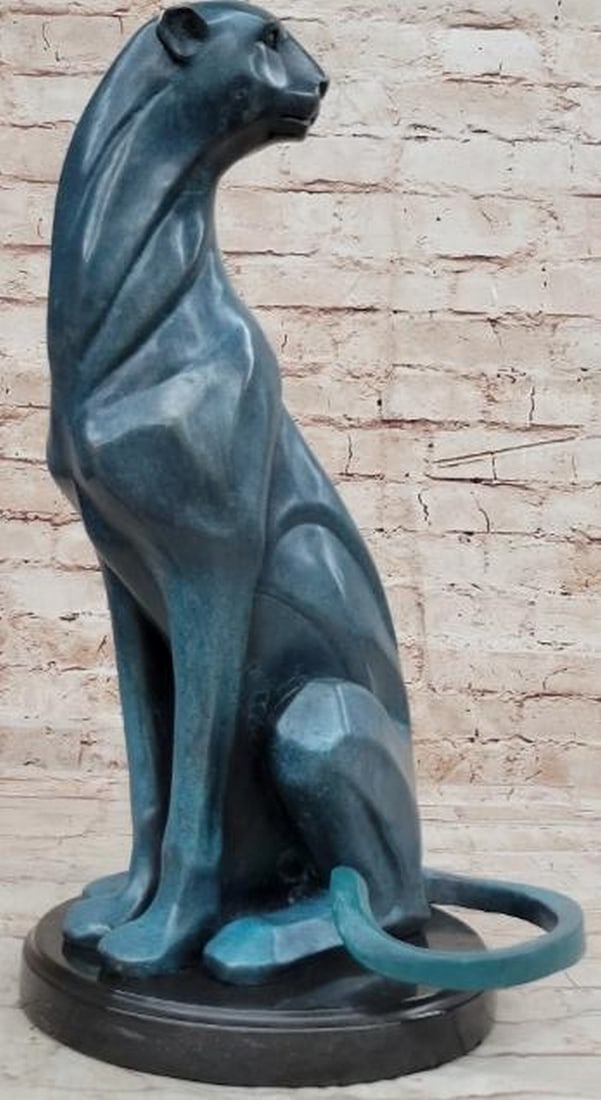 Mountain Lion Bronze Sculpture in Green Patina: Mountain Lion Bronze Sculpture in Green Patina Powerful and poised, this bronze reproduction sculpture captures the raw elegance of a mountain lion, bearing the signature of renowned artist Henry Moor