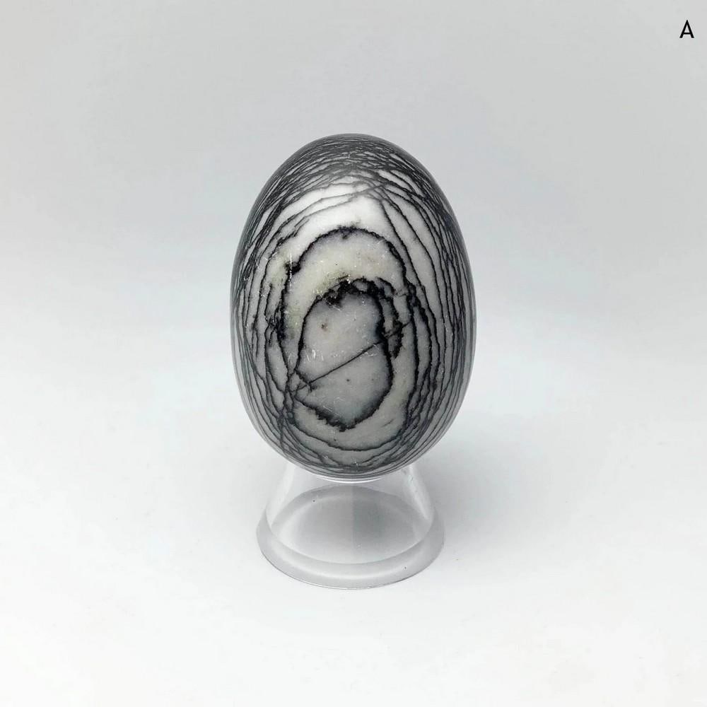 Web Jasper Egg: Web Jasper Egg Web jasper is a grey variety of jasper featuring black banded patterns that resemble a spider web. This gemstone is valued for its grounding properties and is often used in meditation, 