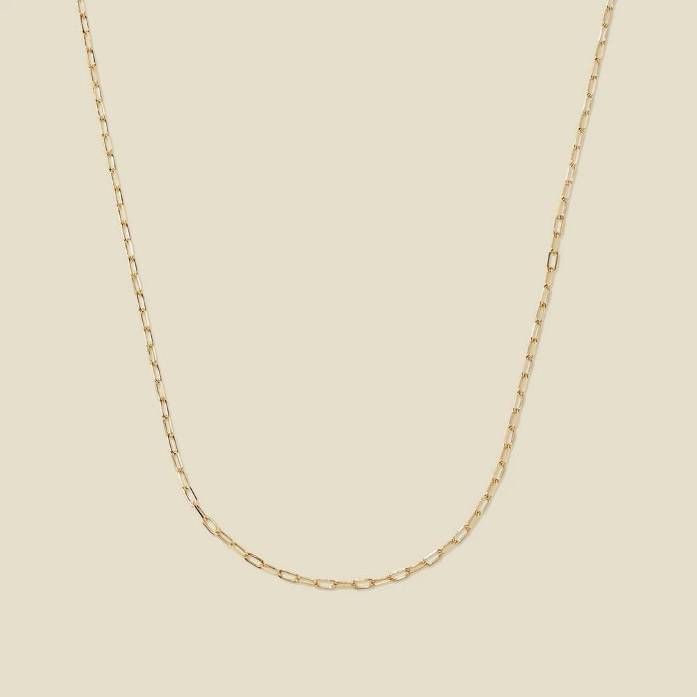 14k Mini Paperclip Chain: 14k Mini Paperclip Chain Craft your perfect look with this refined 14k solid gold chain. Featuring delicate paperclip-style links, it adds a touch of understated elegance and modern sophistication. A 