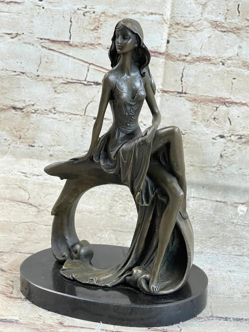 Sitting Woman Bronze Sculpture: Sitting Woman Bronze Sculpture This pose of a peaceful girl sitting with downcast eyes captures the true rebirth of the innocence age. The artist was able to depict elegant nudity that even supersedes