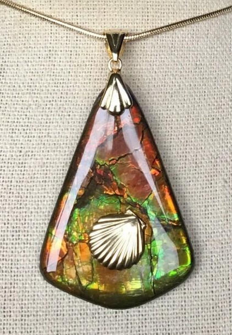 Prismatic Relic Ammolite Pendant: Prismatic Relic Ammolite Pendant This is a nice Ammolite pendant with a gem in autumn colors and a shell accent. This gem has a great stained glass pattern in red, green, orange and gold. The shell