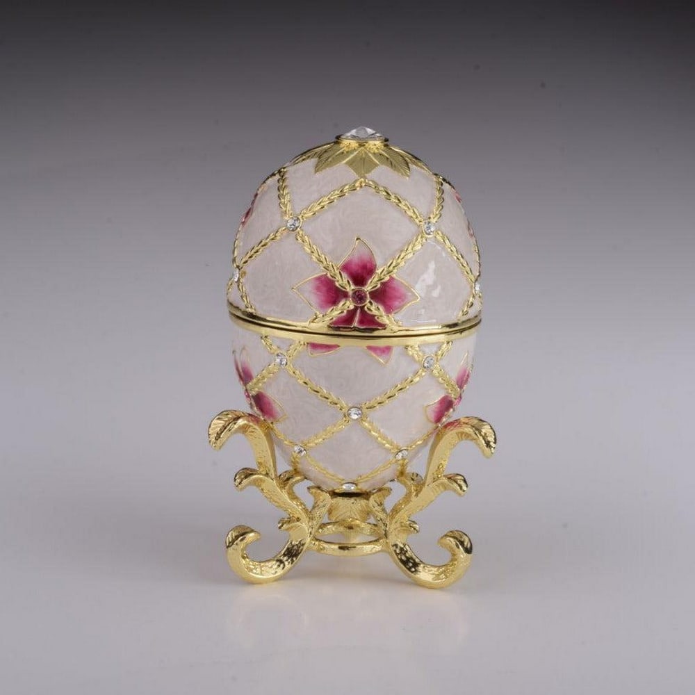 White Egg with Flowers & Harp: White Egg with Flowers & Harp Enamel painted trinket box decorated with austrian crystals. A splendid handmade white russian Egg with flowers and harp surprise inside trinket box. This piece is a 