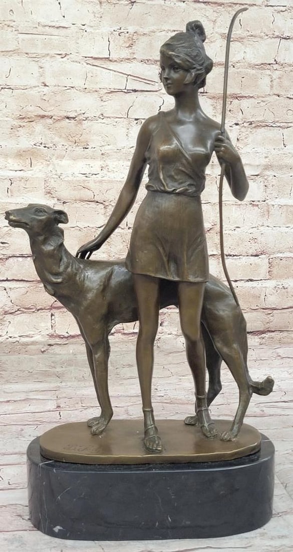 Diana the Huntress Bronze Sculpture after Zach – 17" x 11": Diana the Huntress Bronze Sculpture after Zach – 17" x 11" This bronze sculpture depicts Diana the Huntress, shown standing with a bow and accompanied by a dog. The figure is rendered with