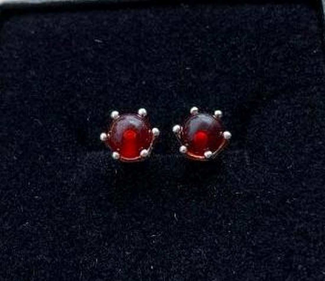 Silver-Tone Stud Earrings with Amber-Colored Stone Sphere: Silver-Tone Stud Earrings with Amber-Colored Stone Sphere Add a touch of warmth and elegance to your look with these minimalist silver-tone stud earrings. Each earring features a smooth,