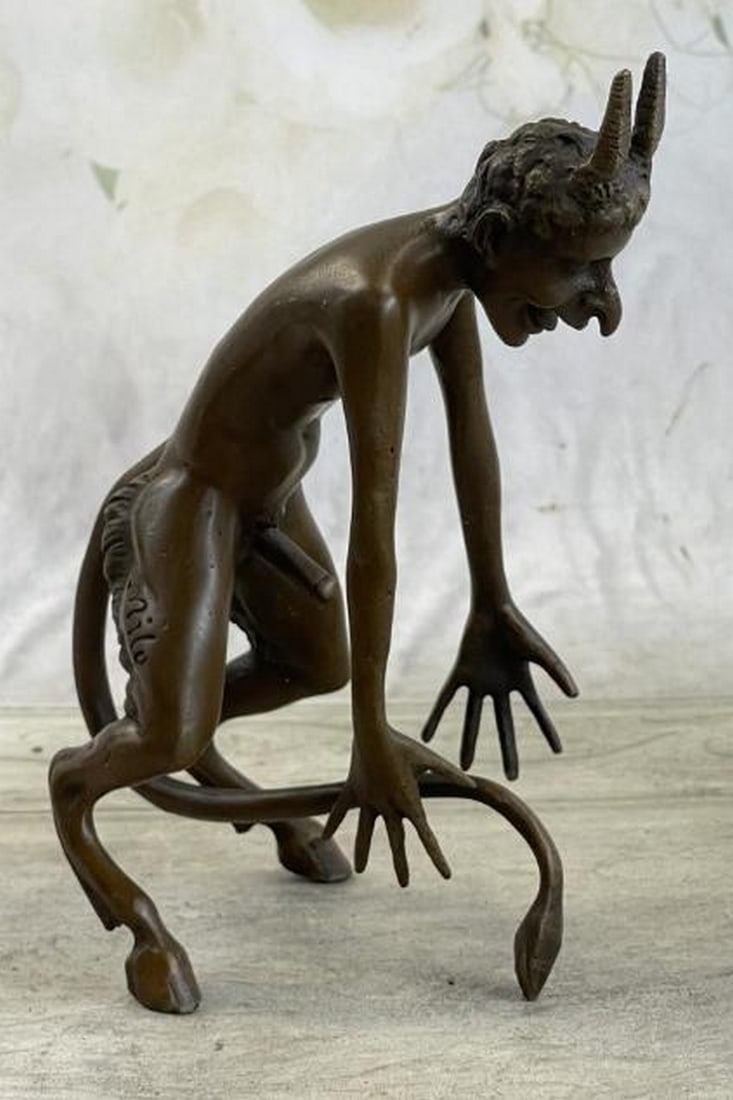 Lustful Satyr Bronze Sculpture: Lustful Satyr Bronze Sculpture A bold and mythologically inspired bronze sculpture depicting a horned satyr or demon in raw, primal form. This provocative figure stands confidently, embodying themes o