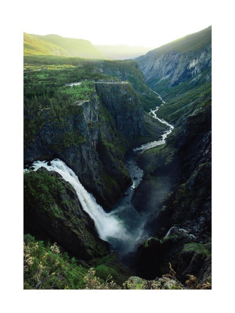 Norwegian Waterfall Poster: Norwegian Waterfall Poster A scenic print featuring Norway’s Vøringsfossen waterfall, cascading 182 meters through a lush green valley. The artwork captures the majesty and natural beauty of this