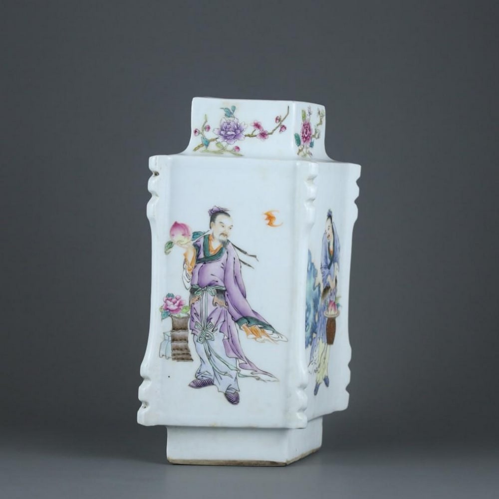 Qing Dynasty Yongzheng Famille Rose Figure Diamond-Shaped Vase: Qing Dynasty Yongzheng Famille Rose Figure Diamond-Shaped Vase A finely crafted diamond-shaped porcelain vase from the Yongzheng period of the Qing Dynasty, beautifully decorated in the vibrant famill