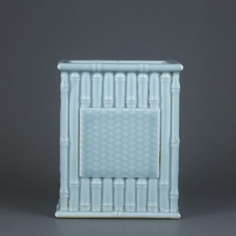 Qing Dynasty Qianlong Sky-Blue Glaze Carved Bamboo Square Pen Holder: Qing Dynasty Qianlong Sky-Blue Glaze Carved Bamboo Square Pen Holder A finely crafted square porcelain pen holder from the Qianlong period of the Qing Dynasty, finished in a soft sky-blue glaze. The s