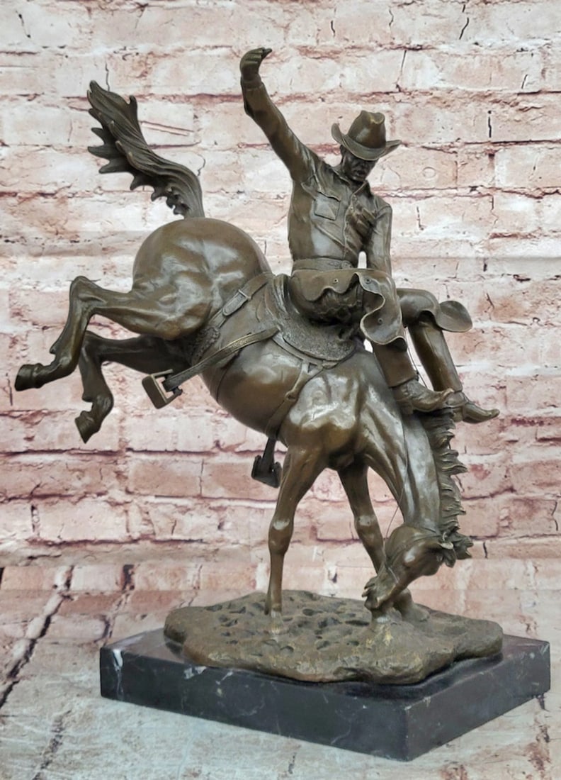 Bronze Sculpture of Cowboy Riding Bucking Horse on Marble Base – 19.5" x 17.5": Bronze Sculpture of Cowboy Riding Bucking Horse on Marble Base – 19.5" x 17.5" Introducing a Bronze Sculpture: This composition depicts a cowboy riding a bucking horse, capturing a dramatic 