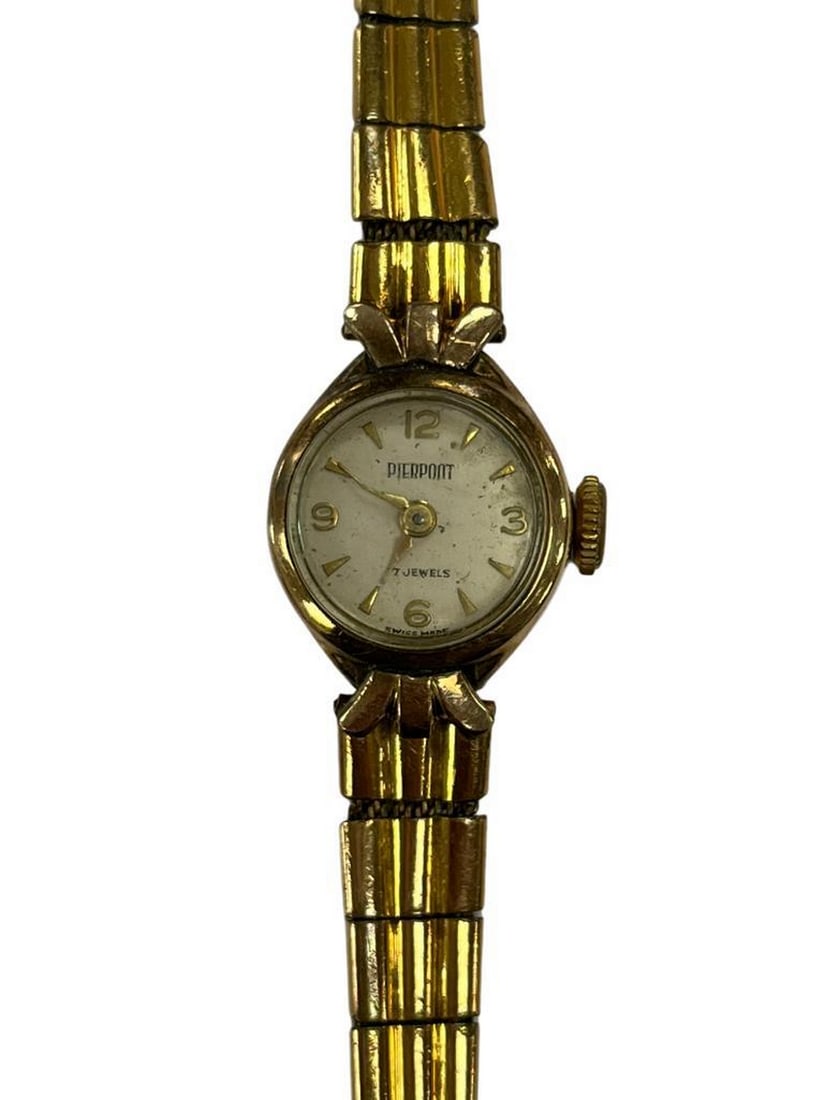 Vintage Gold Tone Pierpont Watch: Vintage Gold Tone Pierpont Watch The Vintage Gold Tone Pierpont Watch is a timeless piece that captures the elegance and sophistication of a bygone era. This classic timepiece features a luxurious gol