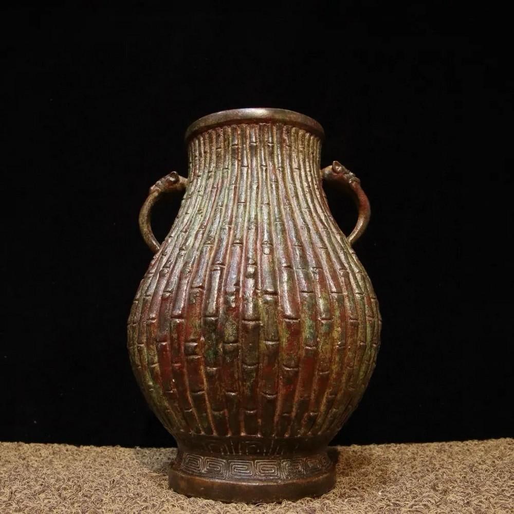 Antique Chinese Bronze Jar with Bamboo Shoot Design: Antique Chinese Bronze Jar with Bamboo Shoot Design This antique Chinese bronze jar features an elegant bamboo shoot design, symbolizing resilience and longevity in Chinese culture. The finely crafted