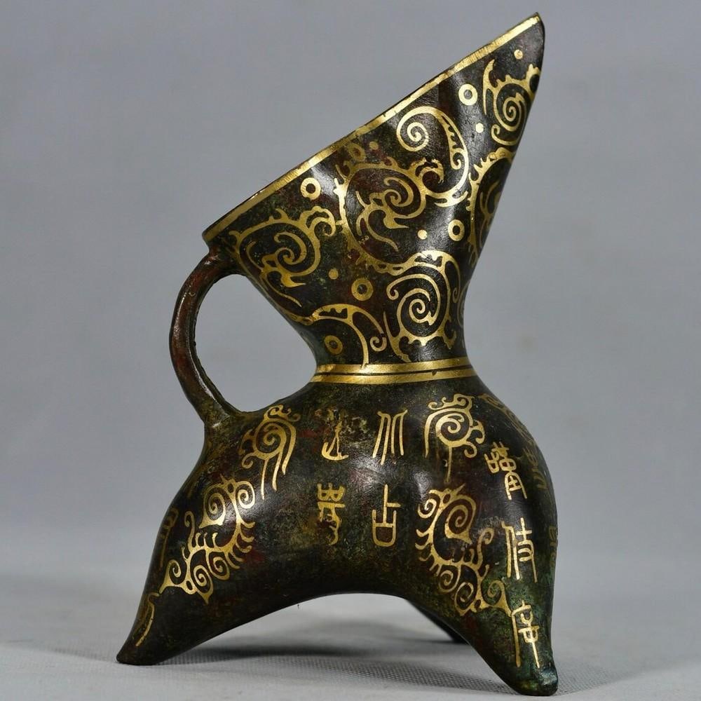 Antique Chinese Handmade Bronze Inlaid Gold Horn Cup Statue: Antique Chinese Handmade Bronze Inlaid Gold Horn Cup Statue This exquisite antique bronze horn cup showcases masterful craftsmanship with intricate gold inlay detailing. Inspired by traditional Chines