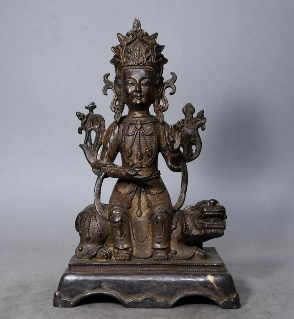 Pure Copper Manjusri Bodhisattva Statue: Pure Copper Manjusri Bodhisattva Statue This rare and exquisite statue of Manjusri Bodhisattva is crafted from pure copper, showcasing the intricate artistry of traditional Chinese craftsmanship. Repr