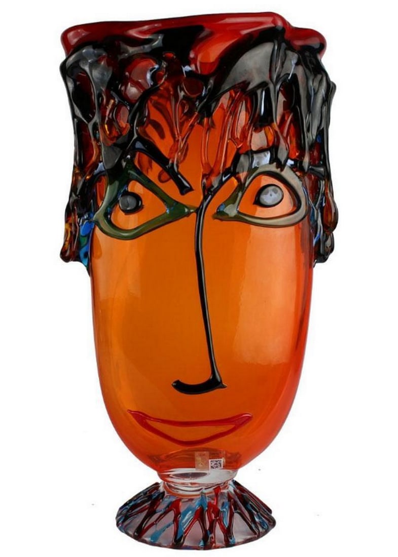 Musana Vase Orange – Tribute to Picasso – Murano Glass: Musana Vase Orange – Tribute to Picasso – Murano Glass This Murano glass vase is designed in the form of an abstract head inspired by modern art movements. It features expressive facial features w