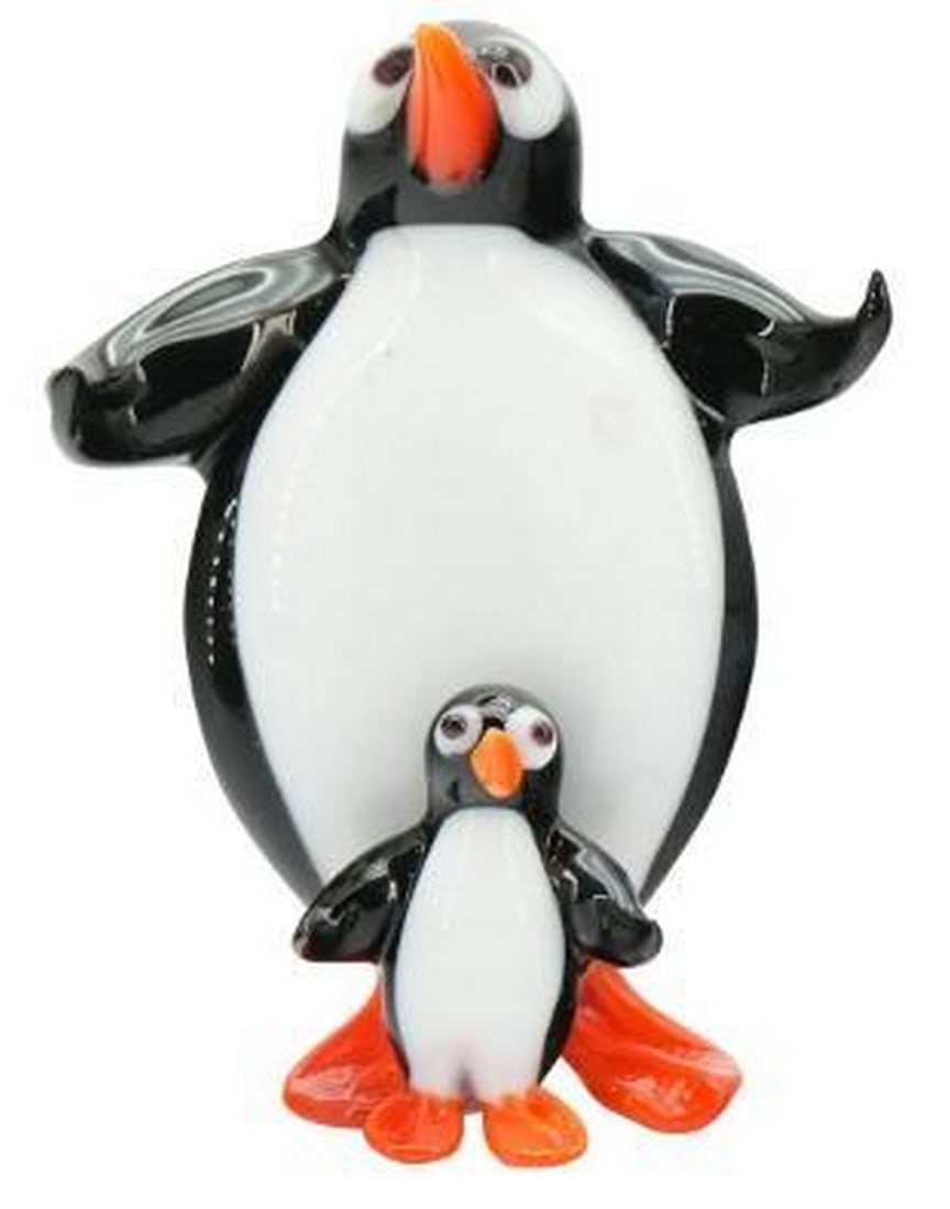 Penguin Pair: Murano Glass Duo: Penguin Pair: Murano Glass Duo This charming Murano glass sculpture features a playful duo of penguins, one larger and standing protectively behind the smaller, creating a heartwarming scene of compan