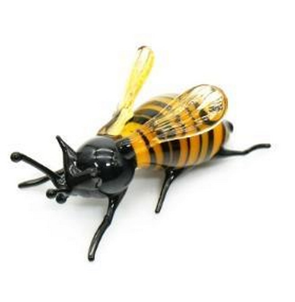 Buzzing Beauty: Murano Glass Bee: Buzzing Beauty: Murano Glass Bee This charming mini Murano glass sculpture captures the delicate grace of a bee in stunning hand-blown glass. Crafted by skilled artisans, the intricate detailing of th