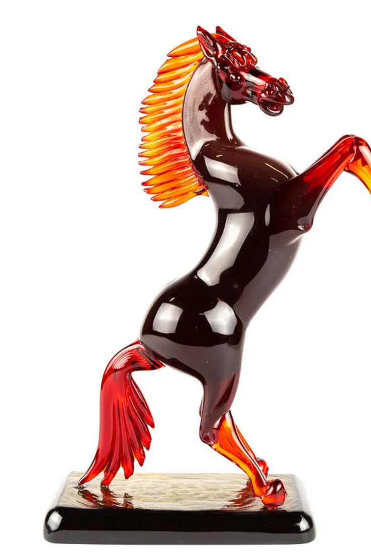 Red Murano Glass Quarter Horse Sculpture: Red Murano Glass Quarter Horse Sculpture This exclusive handmade red horse sculpture is crafted using the warm glass modeling technique, embodying the classic artistry of Murano. A symbol of luxury, i
