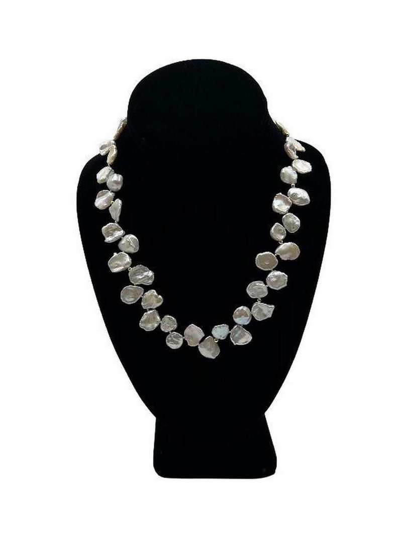 Luxurious Keshi Coin Pearl Necklace: Luxurious Keshi Coin Pearl Necklace Keshi pearls are individually pinned together to create a rope-like dangle of pearly iridescence. These pearls are known for their breathtaking luster, the beautifu