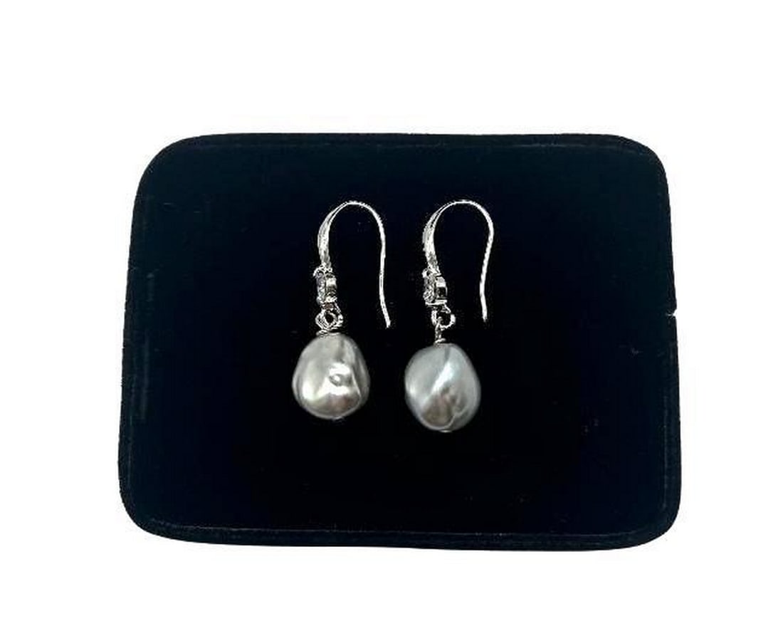Glamorous Grey Keshi Pearl Dangle Earrings: Glamorous Grey Keshi Pearl Dangle Earrings This pair of earrings features gorgeous grey keshi pearls that are approximately 11mm in size. A stunning white gemstone sits above the pearl on each earring