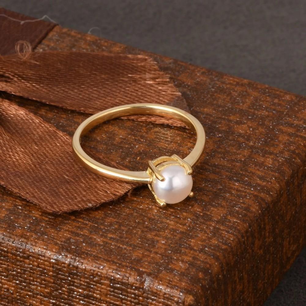 Minimalist Round Pearl Ring Yellow Gold Plated: Minimalist Round Pearl Ring Yellow Gold Plated Elegant and timeless, this round pearl ring features a luminous centerpiece set in yellow gold plating. A perfect gift for any occasion. Size: 8 View pho