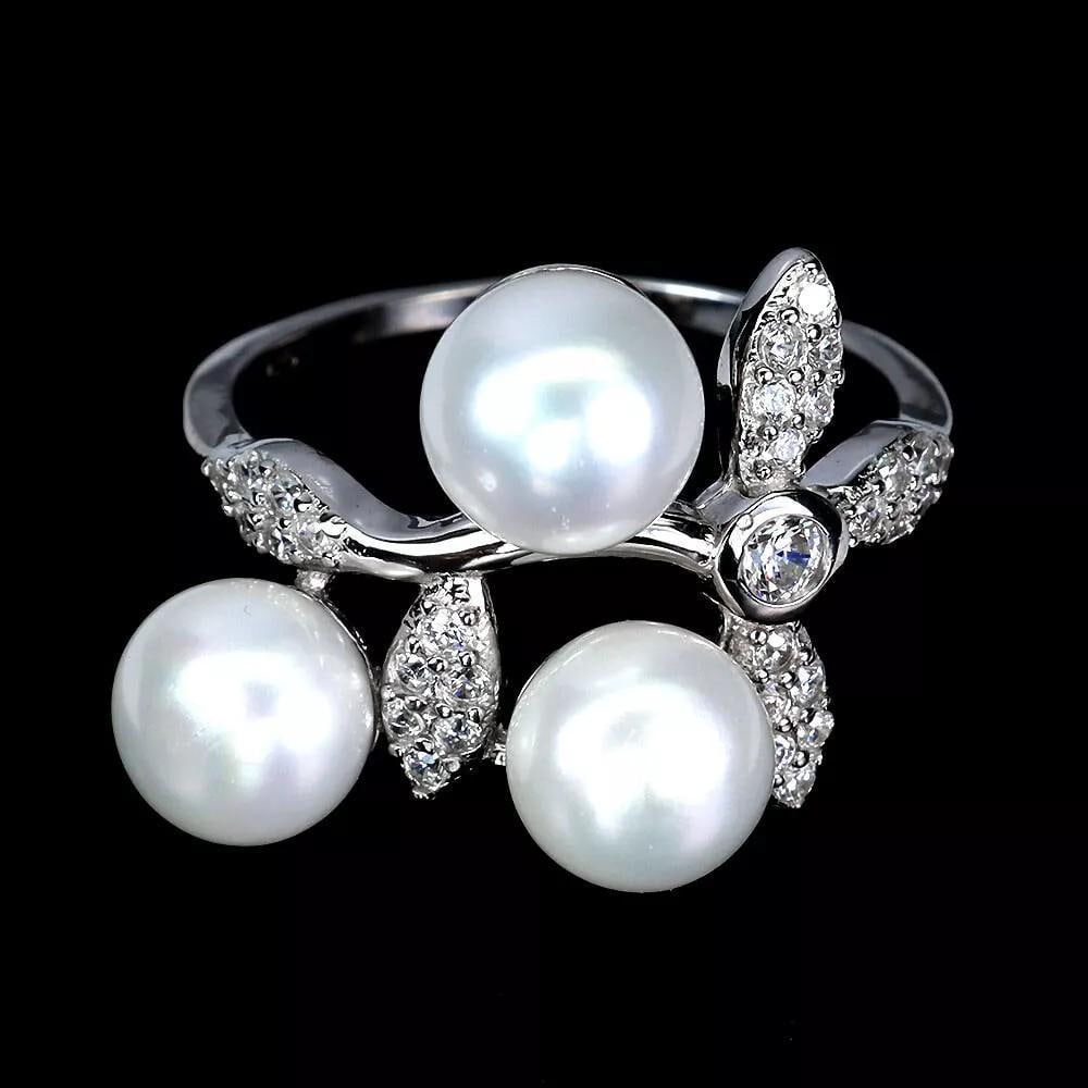 Classic Round White Pearl 7mm Silver Ring - Size 7: Classic Round White Pearl 7mm Silver Ring - Size 7 Embrace timeless elegance with this Classic Round White Pearl 7mm Silver Ring in Size 7. Featuring a lustrous 7mm natural white pearl set in polished