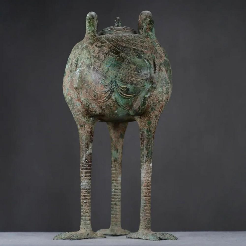 Antique Chinese Bronze Crane Pot Statue: Antique Chinese Bronze Crane Pot Statue This rare handcrafted bronze statue features a gracefully designed crane pot, symbolizing longevity, peace, and prosperity in Chinese culture. The intricate det