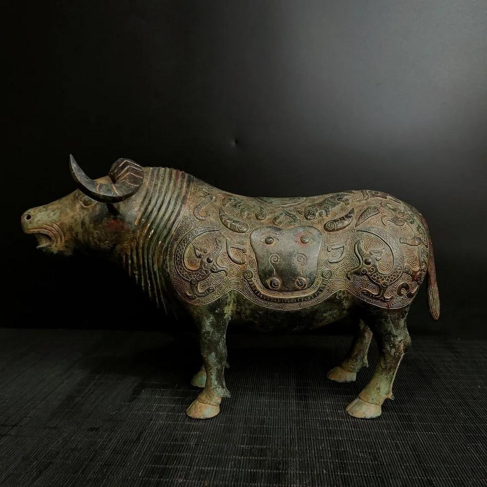 Antique Chinese Bronze Bull Statue: Antique Chinese Bronze Bull Statue This antique Chinese bronze bull statue exudes strength and resilience, symbolizing prosperity and determination. The finely detailed depiction of the bull’s power