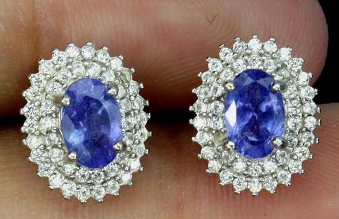 925 Sterling Silver Earrings with Oval Tanzanite (6×4mm) Natural Gemstones: 925 Sterling Silver Earrings with Oval Tanzanite (6×4mm) Natural Gemstones These refined 925 sterling silver earrings showcase stunning natural tanzanite gemstones in a classic oval cut, measuring