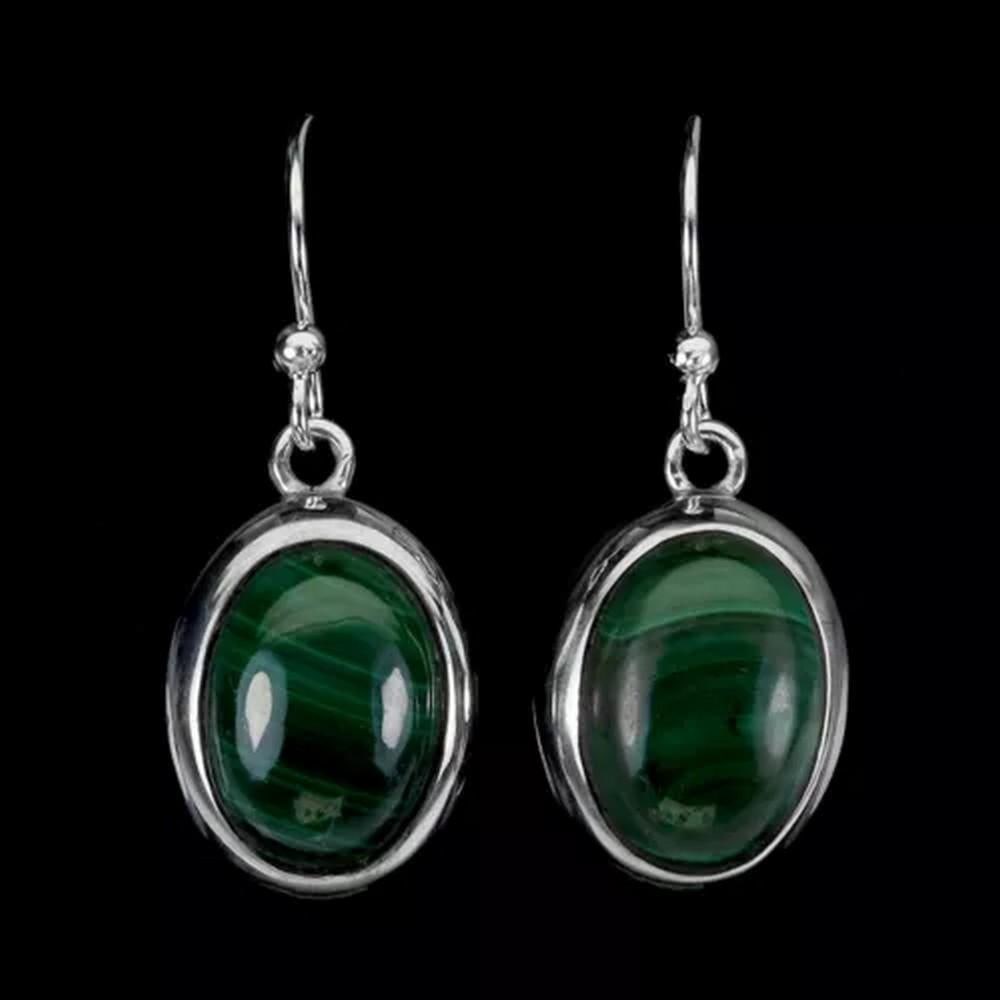 Sterling Silver & Oval Malachite Earrings: Sterling Silver & Oval Malachite Earrings These sterling silver earrings feature elegant oval malachite stones, renowned for their rich green hues and unique patterns. The smooth, polished setting