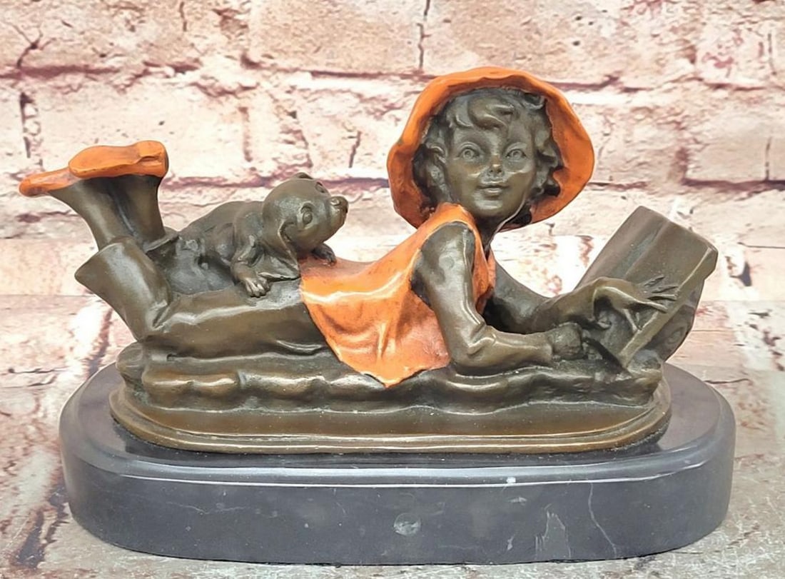 Bronze Girl Reading Sculpture on Marble Base - 5.5" x 8": Bronze Girl Reading Sculpture on Marble Base - 5.5" x 8" Bronze sculpture depicting a young girl absorbed in reading, mounted on a polished black marble base. This piece is handcrafted using t